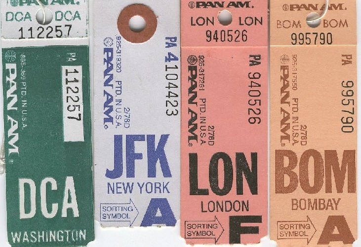 A group of Pan Am baggage tags from the 1980-85 time period.  Destinations are listed left to right, Washington DC, USA, JFK Airport New York, USA, London, UK and Bombay, India.